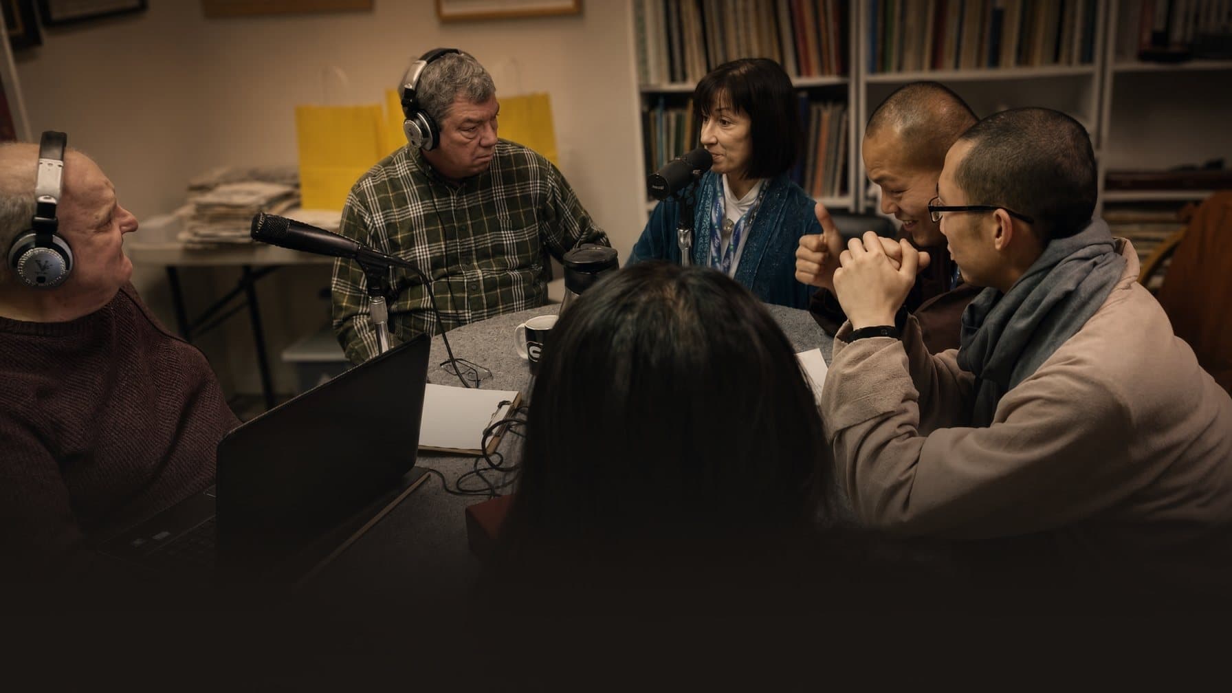 A recording session for The Choral Director’s Toolbox, with hosts and guests around a table of microphones