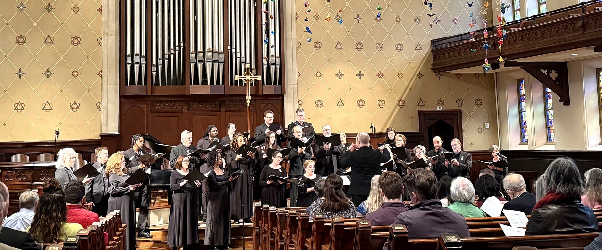 New South Festival Singers standing together in concert