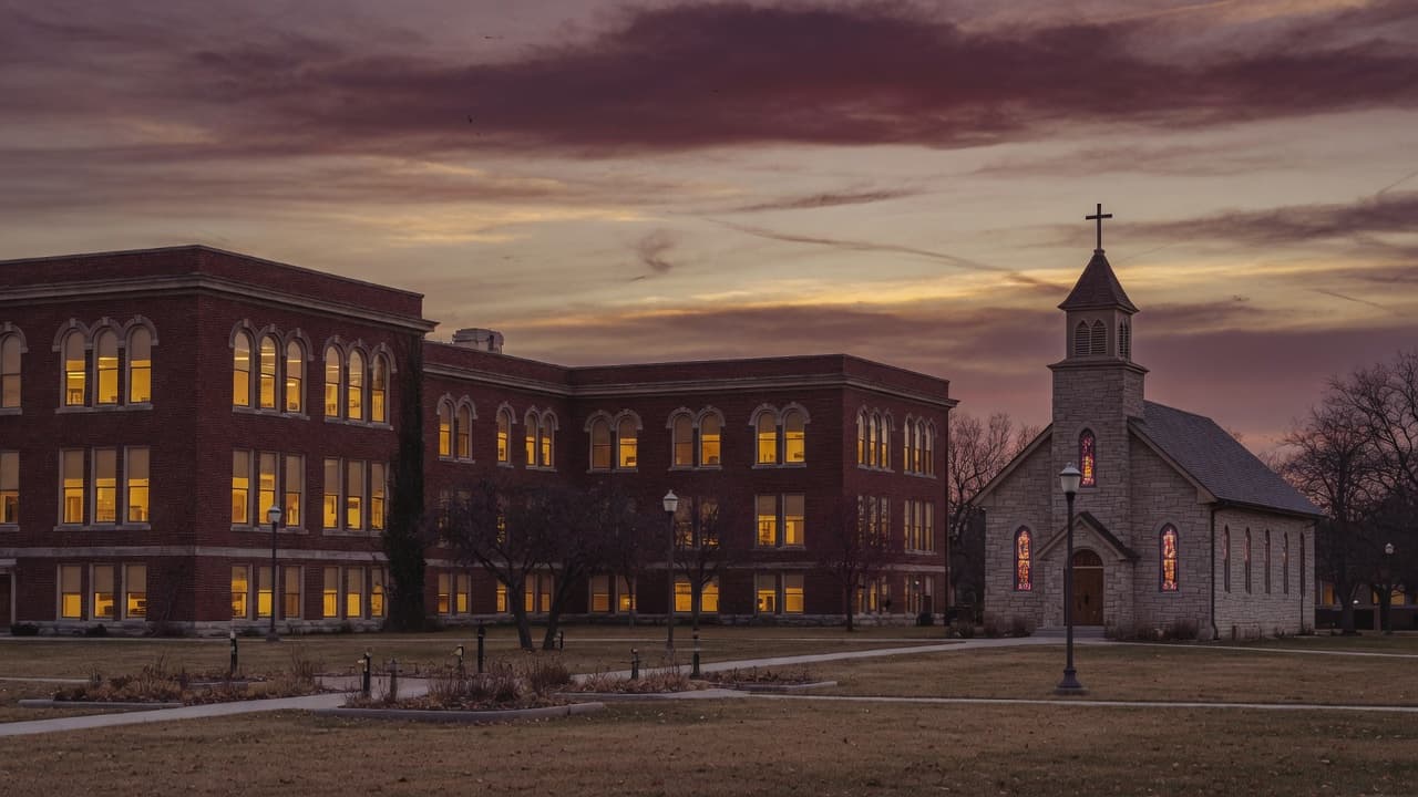Dusk light on a brick college hall and chapel in Forest City, Iowa